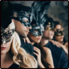 Guests in black lace masks at a masked party